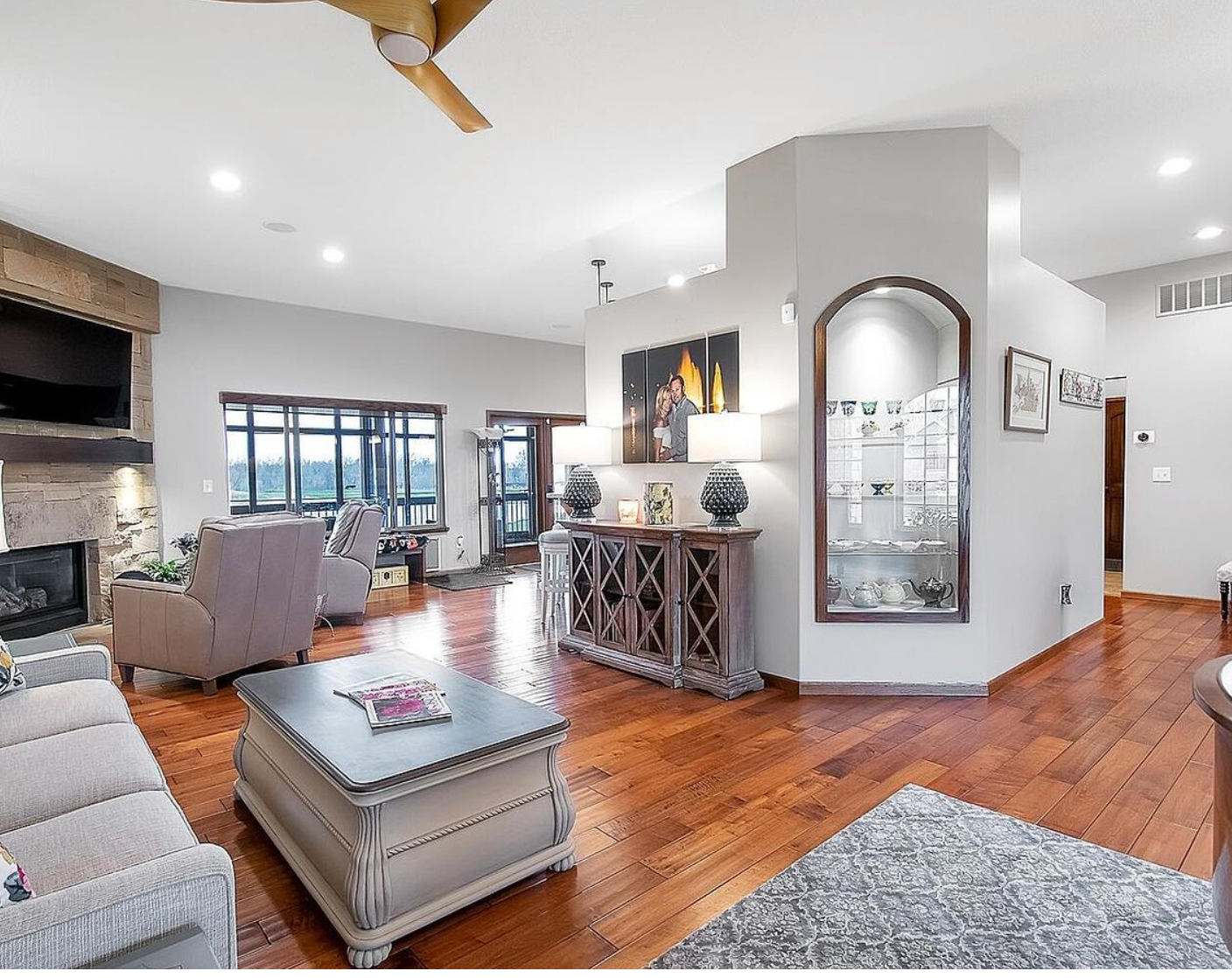 Beautiful Central Kansas home interior with hardwood floors and stone fireplace